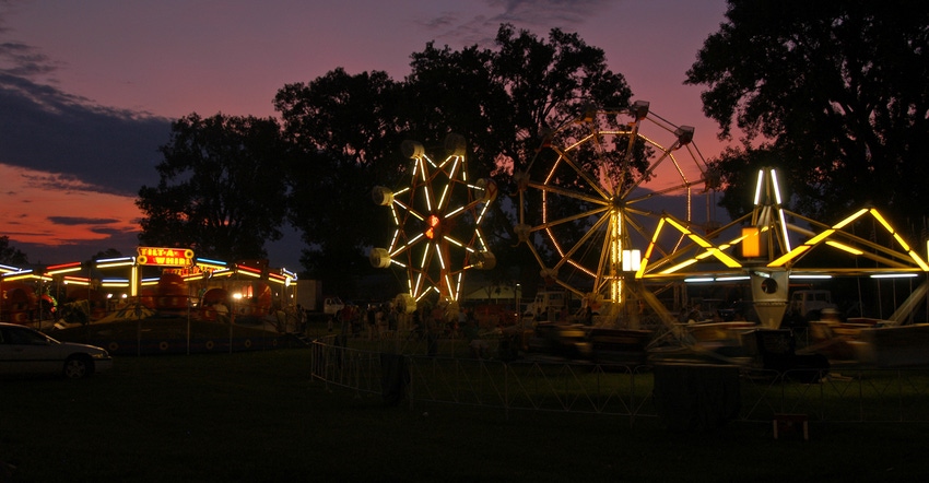 rides at the county fair at night