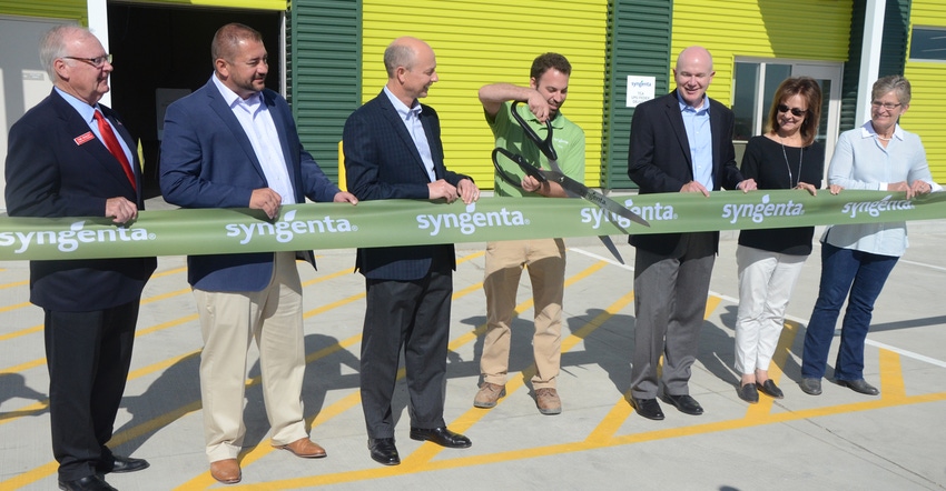 At center, site manager Joe Bevilacqua cuts the ribbon for Syngenta's new Trait Conversion Accelerator at Nampa, Idaho. Tom K