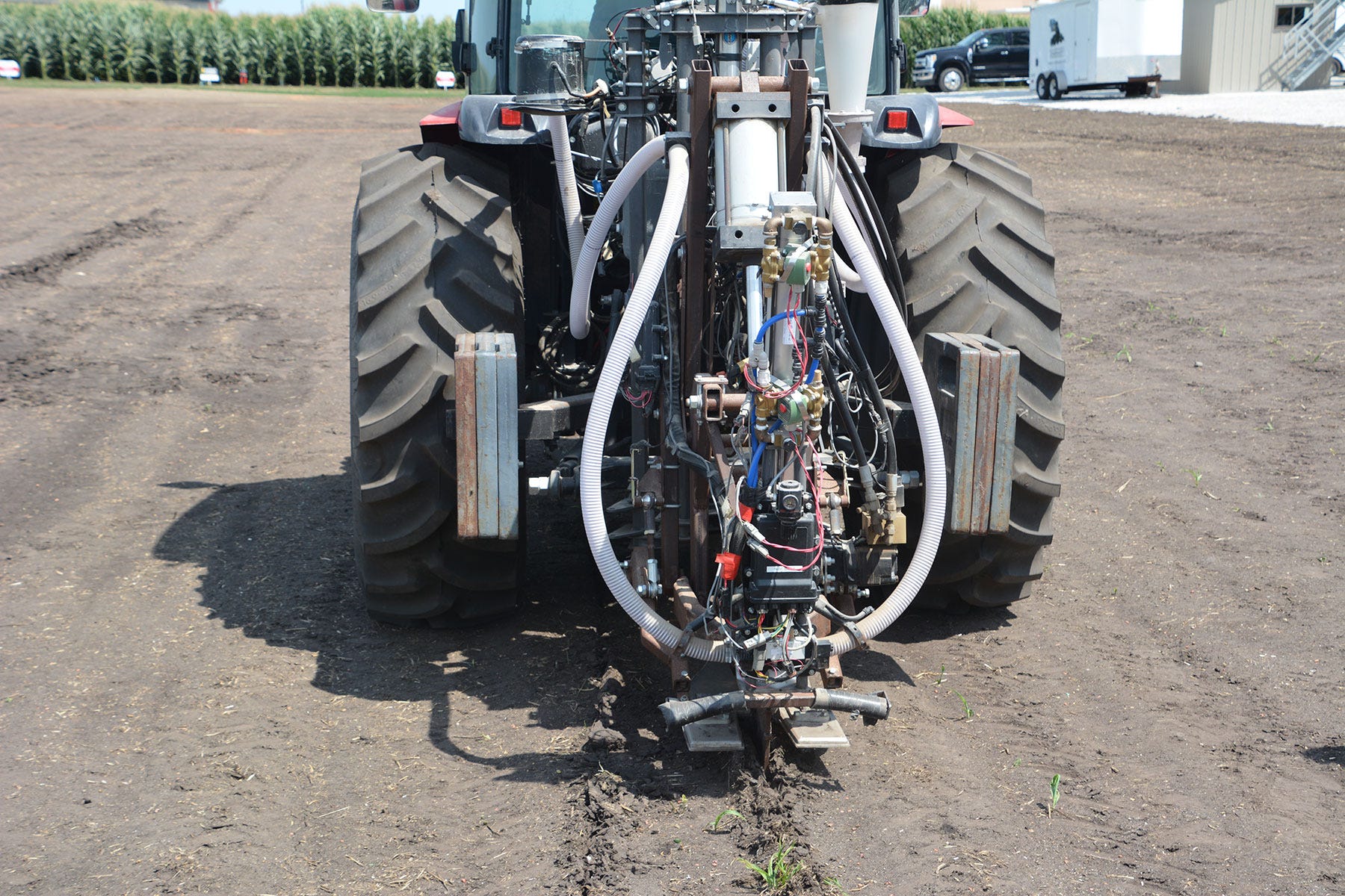 prototype soil sampler mounted on back of tractor