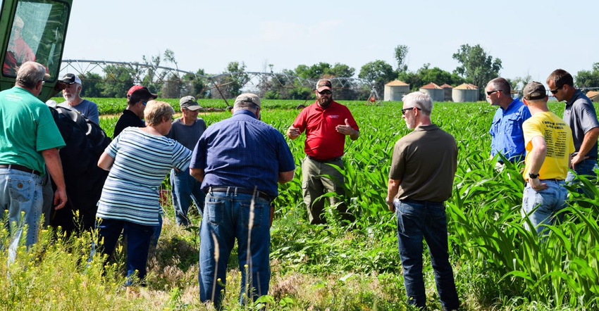 farmer discusing Harrison County pest resistance management at field days farmer discusing Harrison County pest resistance management at field days