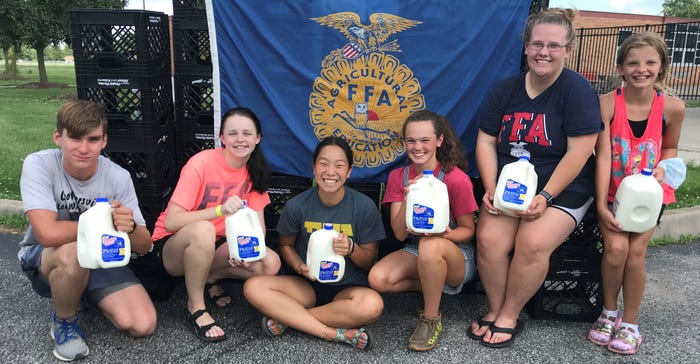 Members of the Crothersville FFA Chapter hold gallons of milk