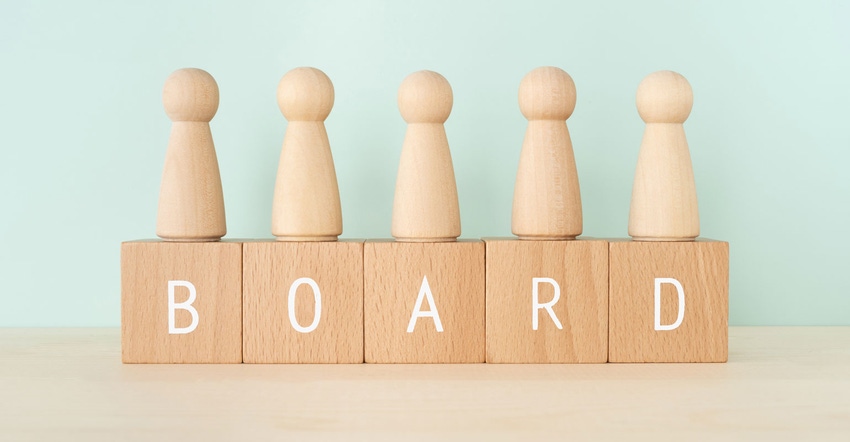 Wooden gamepiece pegs on a block that says "BOARD"