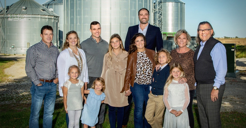 Steve Sukup and family in front of grain bins