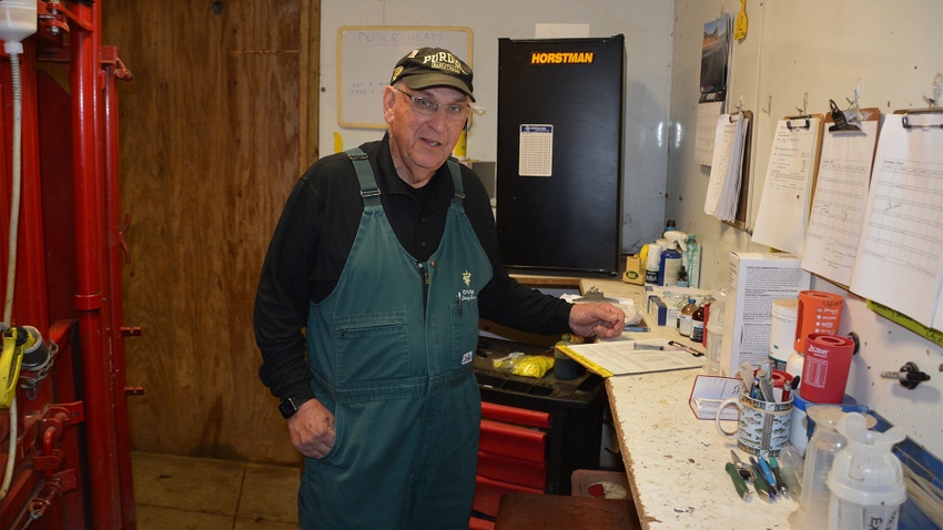 Veterinarian Larry Horstman working in his facility at his farm
