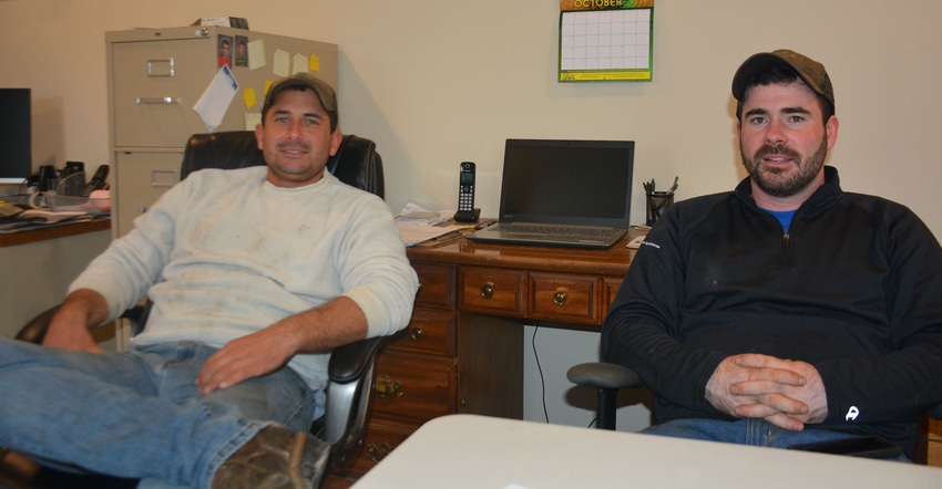 Bryan and Chris Harnish relax in their farm office Bryan and Chris Harnish relax in their farm office
