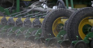 Close up of a tractor tilling crops