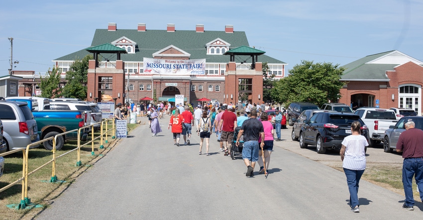 attendees walk towards the entrance of the Missouri State Fair