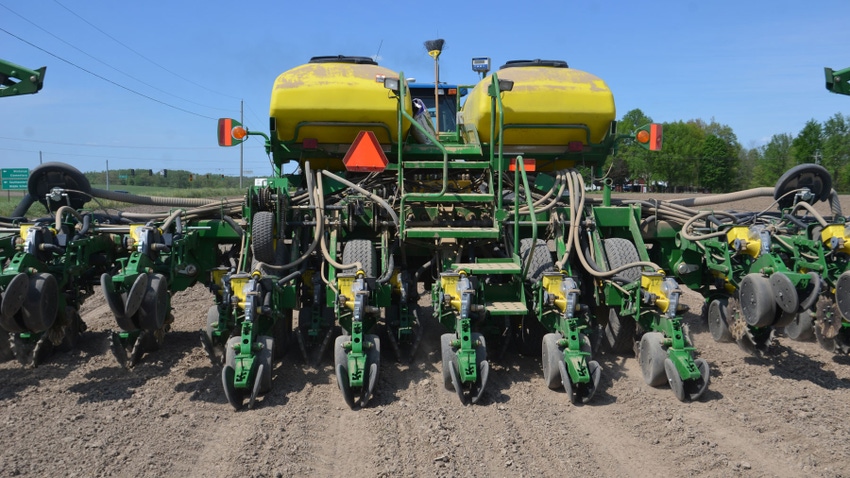 Planter equipped with solid rubber closing wheels on soybean splitter rows