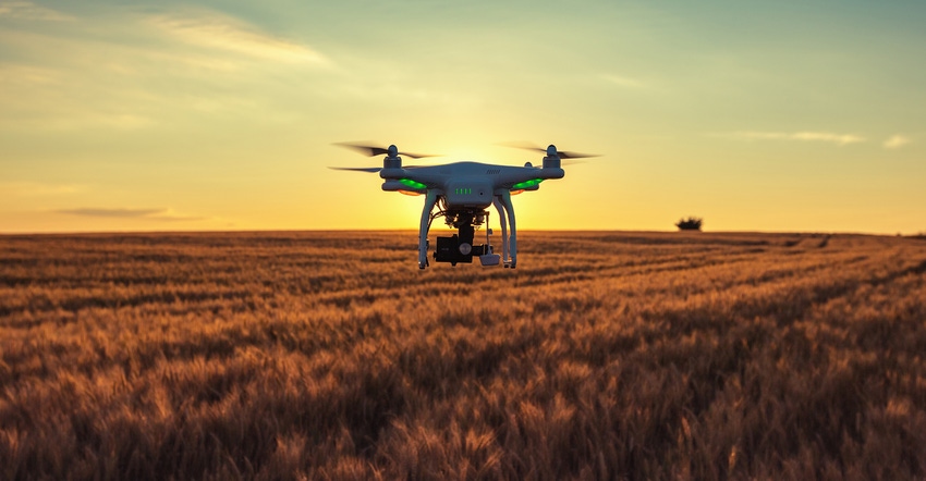 drone in the air above farmland