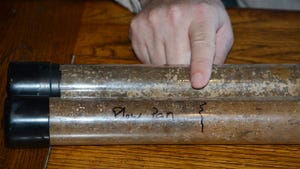 Two plastic tubes with soil samples