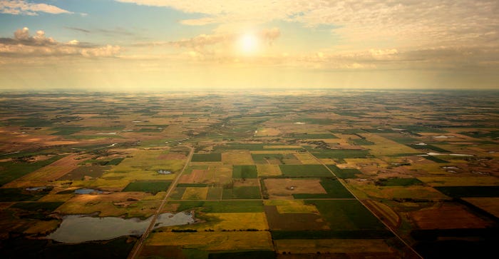 sunrise on horizon, aerial view of South Dakota farmland. 