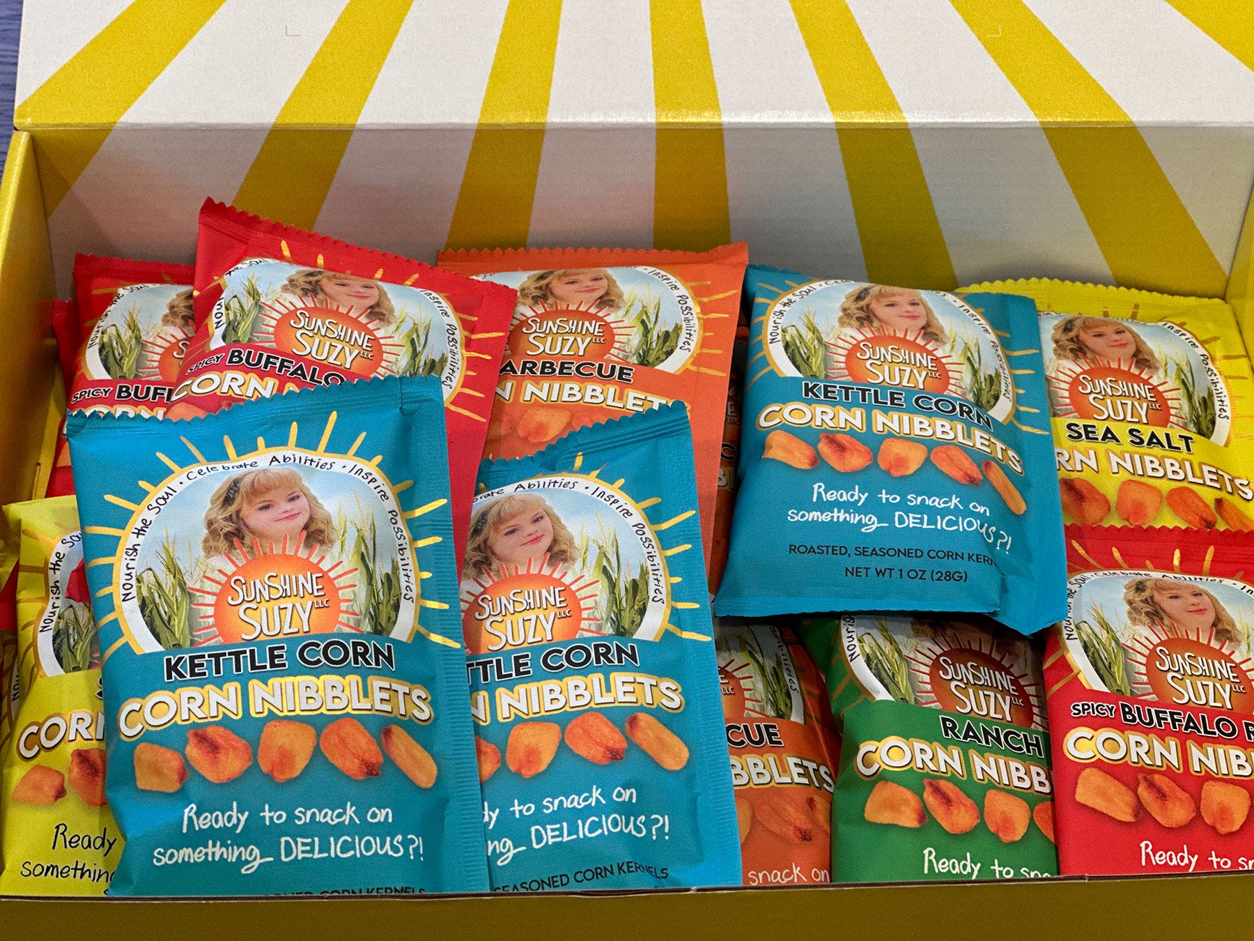 Individual bags of Sunshine Suzy corn nibblets packaged in a box