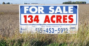 for sale sign in field 134 acres for sale