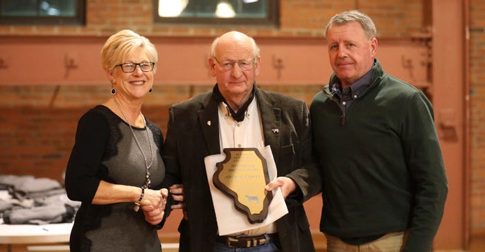 Paul Walker presents the Pioneer Award to Bobby and Sherry Adcock during the 2019 Illinois Beef Expo
