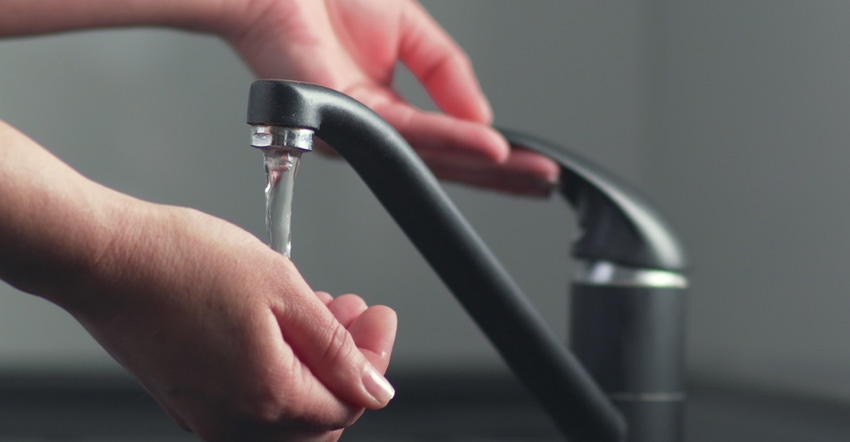 Hands and faucet with running water Hands and faucet with running water