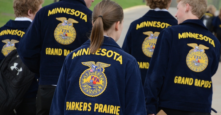 view from behind of FFA kids walking and wearing their blue FFA jackets