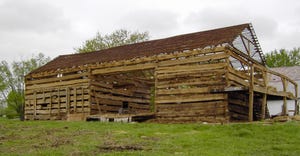 Old log barn that is falling apart