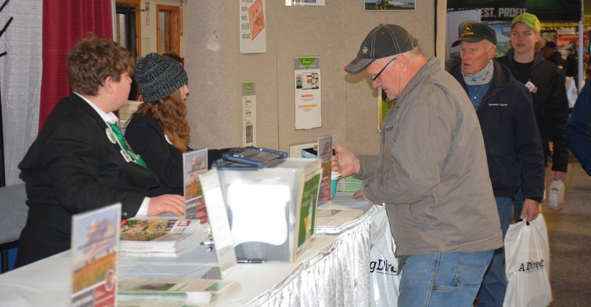 attendees visit the American Agriculturist booth at the NYFS