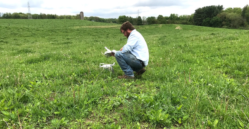 John Scott, Purdue Digital Agriculture Extension Coordinator, prepares a drone for an aerial flight 