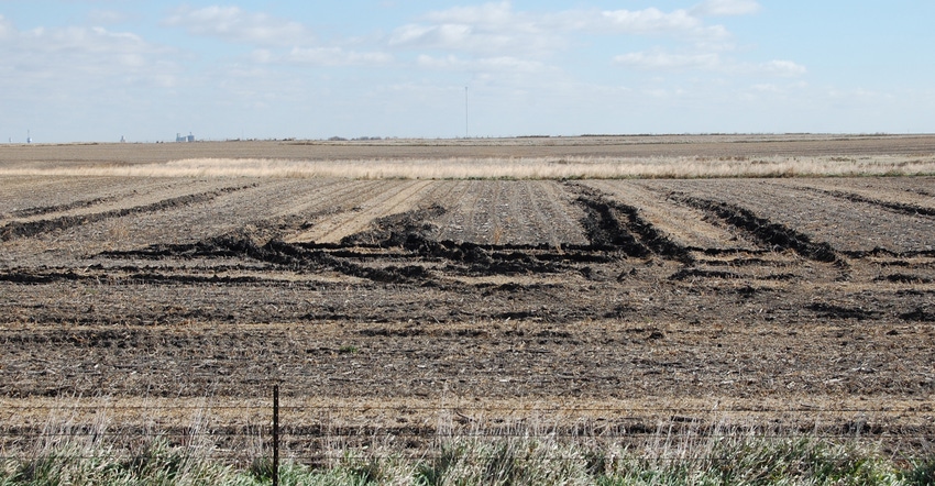 a field with ruts left by combines 