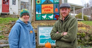 Scout Proft and son Eben stand together outside at Someday Farm in East Dorset, Vt