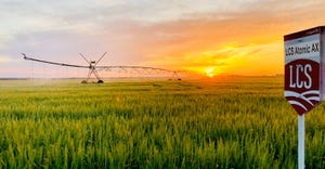 Sunset and irrigation equipment in field