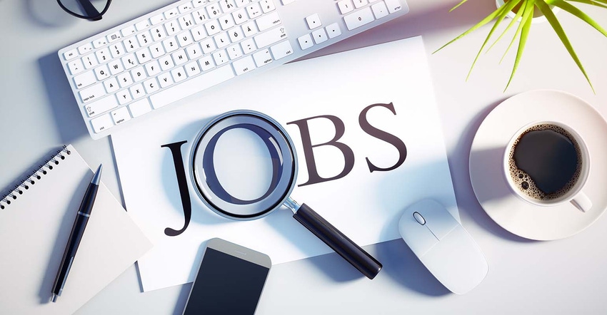 Desk with keyboard, mouse, and "JOBS"