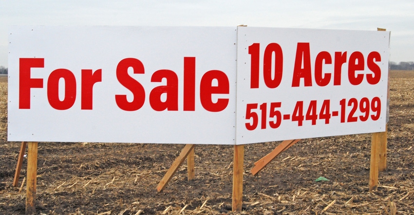 sign reading "10 acres for sale"