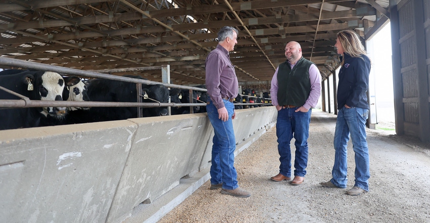 Jamie and Larisa Willrett and Josh St. Peters at a beef farm Jamie and Larisa Willrett and Josh St. Peters at a beef farm
