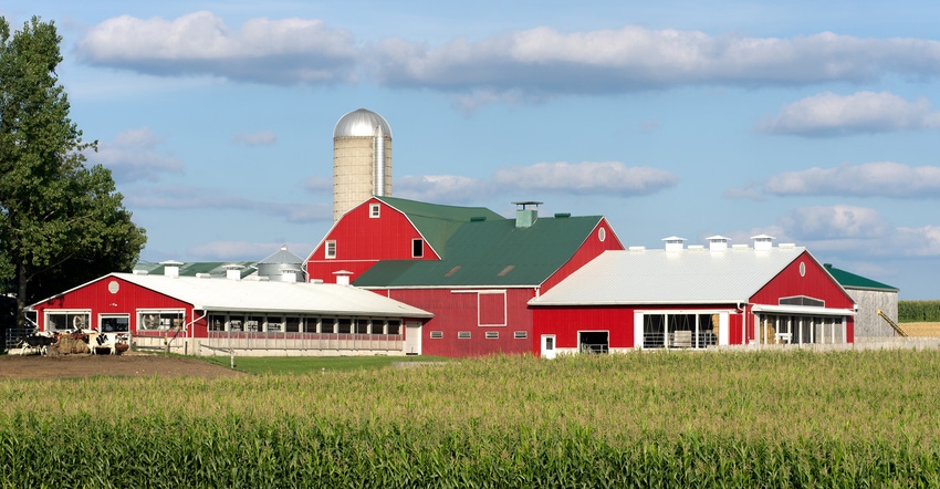 Landscape of a red barn and silos