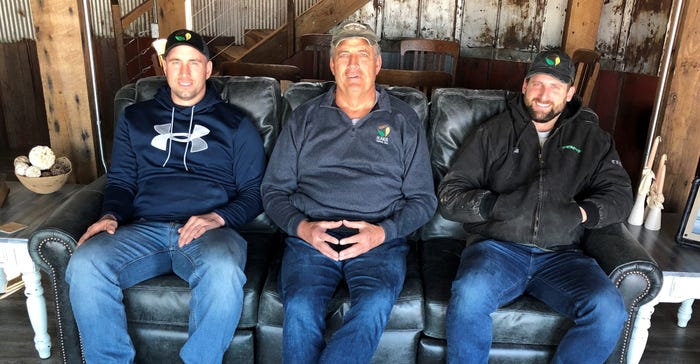Kyle Dyer, Rick Roach and Richard Roach sitting on couch