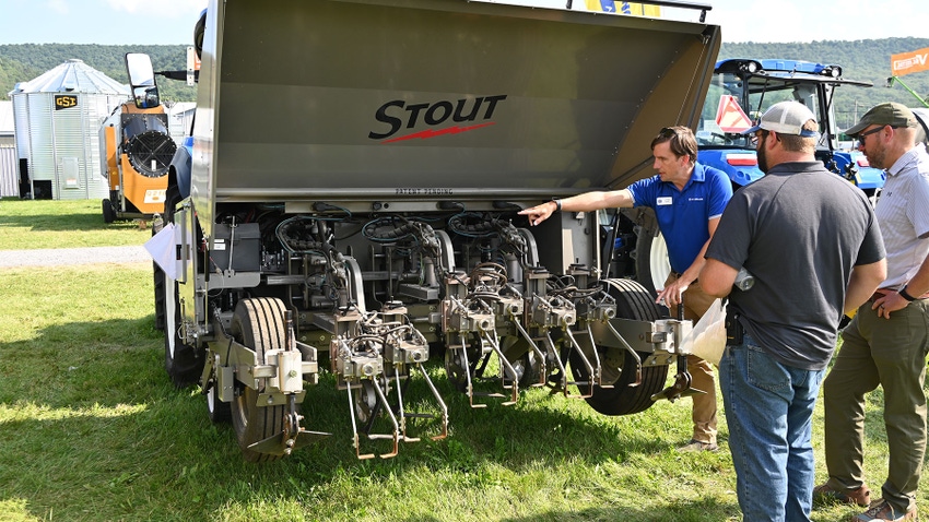 J. Cole Sanford showing visitors the Stout Smart Cultivator