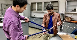 Penn State researchers Lihua Zeng, visiting scholar, and Aslan Zahid, Ph.D. candidate, measure branch-cutting force