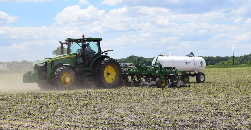 Farmer spraying field Farmer spraying field