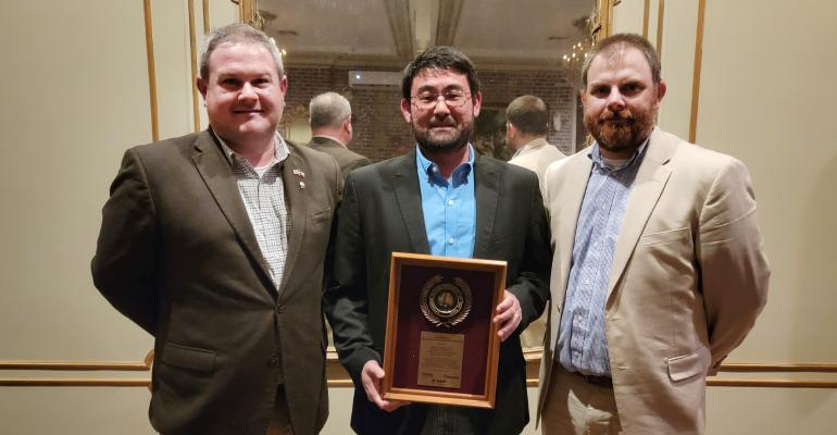  Beltwide Extension Cotton Specialist of the Year honoree Murilo Maeda, center, with cotton specialists Ben McKnight, Texas A