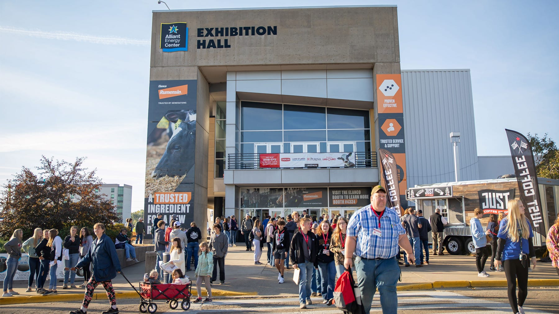 crowds of people exiting a large building called Exhibition Hall