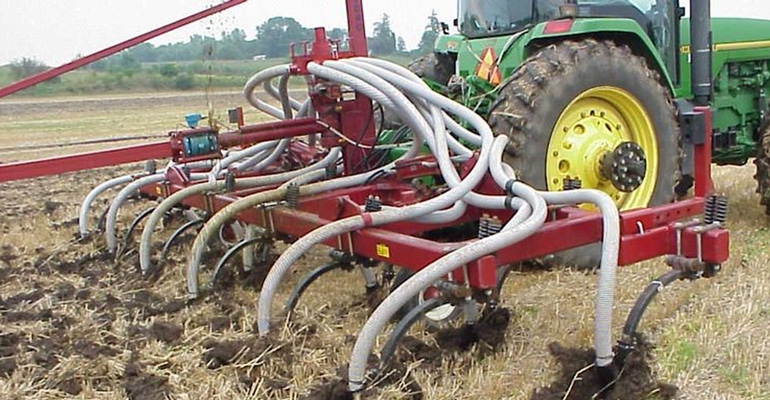 Manure being injected into wheat stubble. 