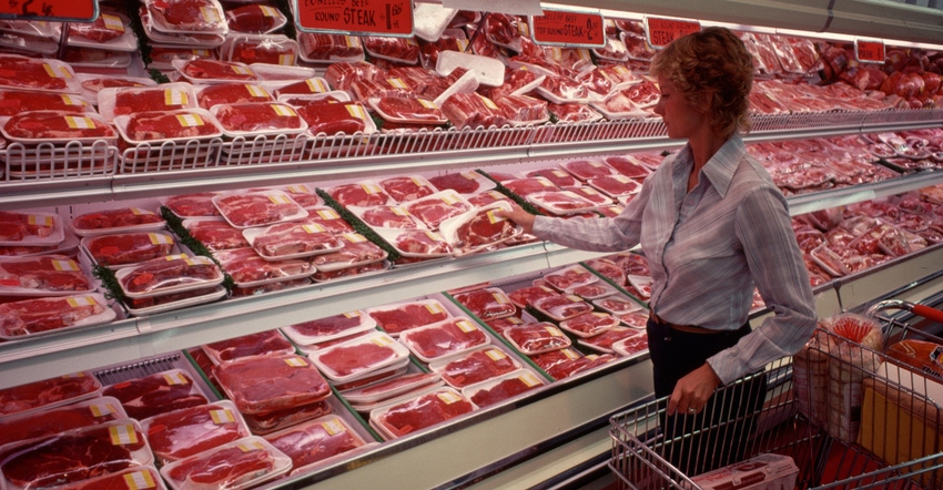 Woman shopping for meat at the grocery store