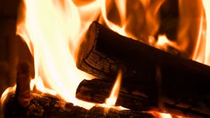 Close up of a log burning in a stove