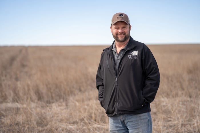 Colorado farmer Scott Scheimer standing in a field