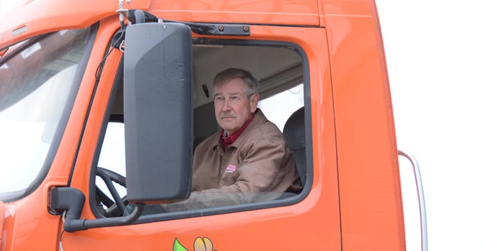 Jim Raben sitting in cab of truck