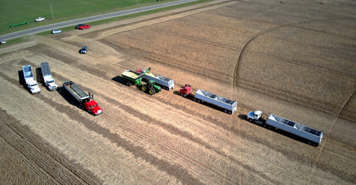 trucks and harvesting equipment showed up to harvest crops for a family in need in LaGrange County, Ind