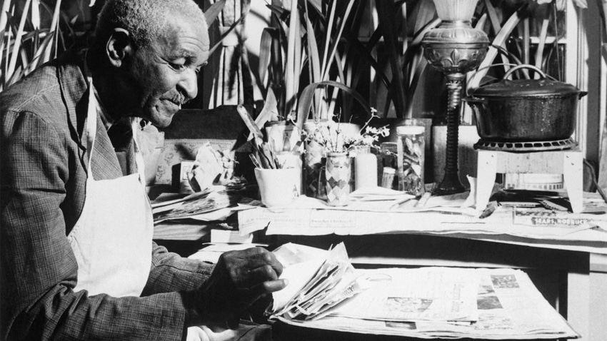 A black and white historical image of botanist George Washington Carver