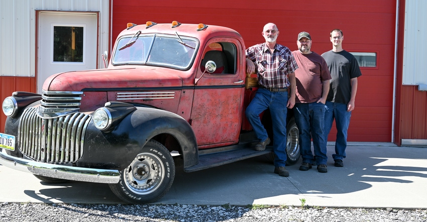 Don, Scott and Kevin Uthe next to pickup turck Don, Scott and Kevin Uthe next to pickup turck