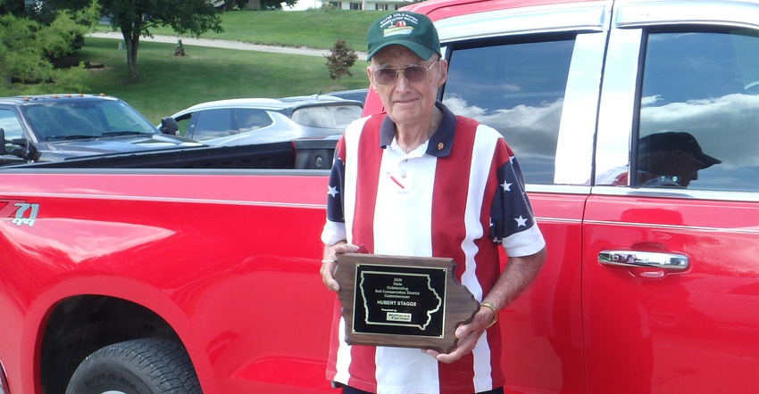 Hubert Staggs of Wayne County holding award plaque