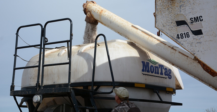 loading fertilizer by auger