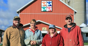 Larry and Mary Ann Mynsberge and Dyan and David Gwidt in front of Shawano County's 350th barn quilt