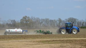 tractor and equipment applying anhydrous ammonia to crop field