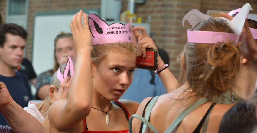 Minnesota State Fair attendees in oink booth crowns
