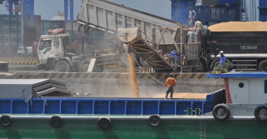 grain being put in a boat grain being put in a boat